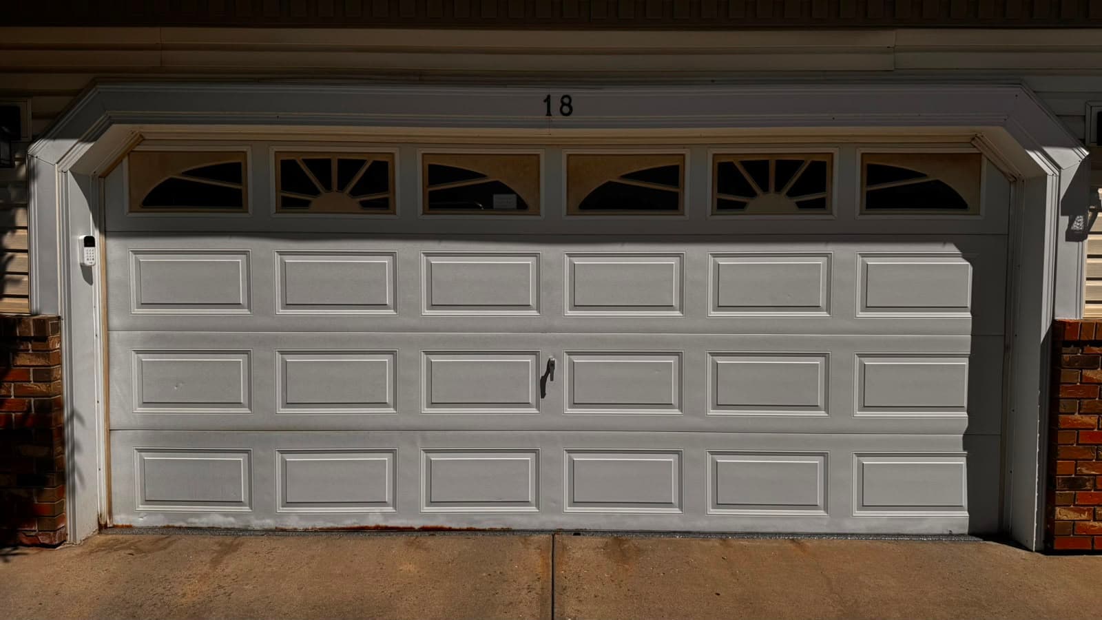 Worn garage door before replacement