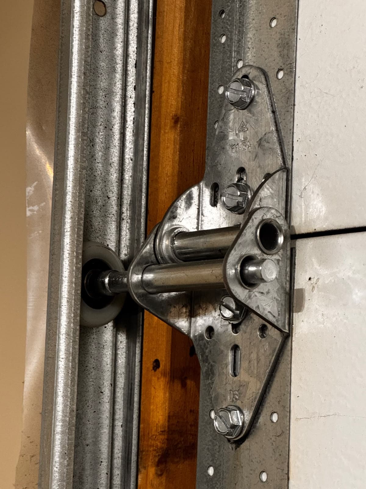 Garage door roller and hinge hardware